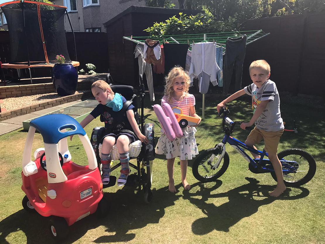 siblings having fun in the garden